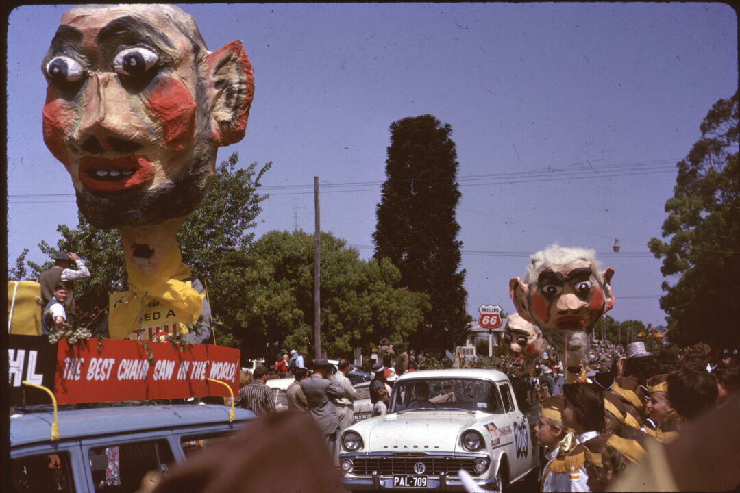 William KEITH / Three grotesque ‘heads’ in Carnival of Flowers parade c 1960s / colour photograph / Local History and Robinson Collections, Toowoomba Regional Libraries – William Keith Collection